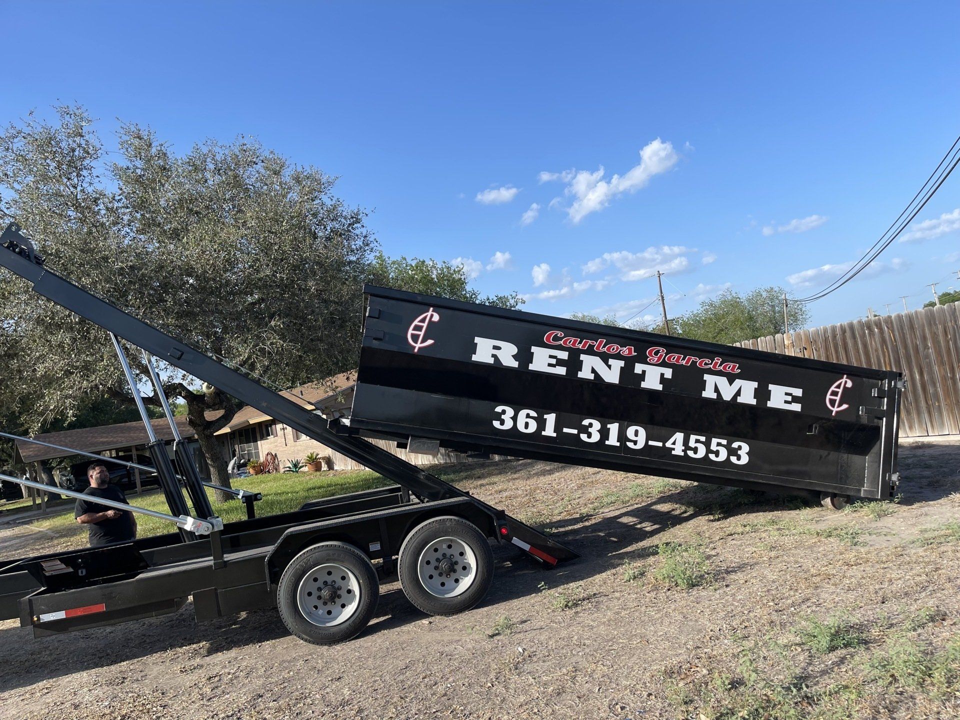 Dumpster lifted on a trailer
