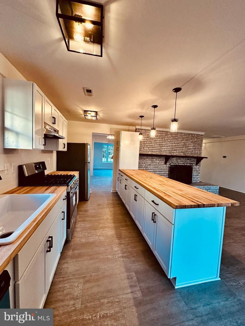 A kitchen with a large island in the middle of it.