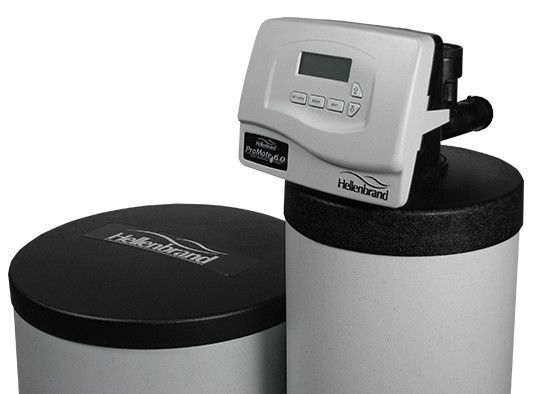 A water softener with a digital display on top of it