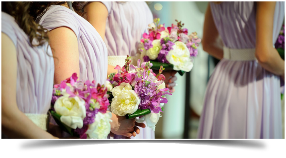 Bridesmaids bridal party holding flowers