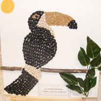 child art of toucan made of beans