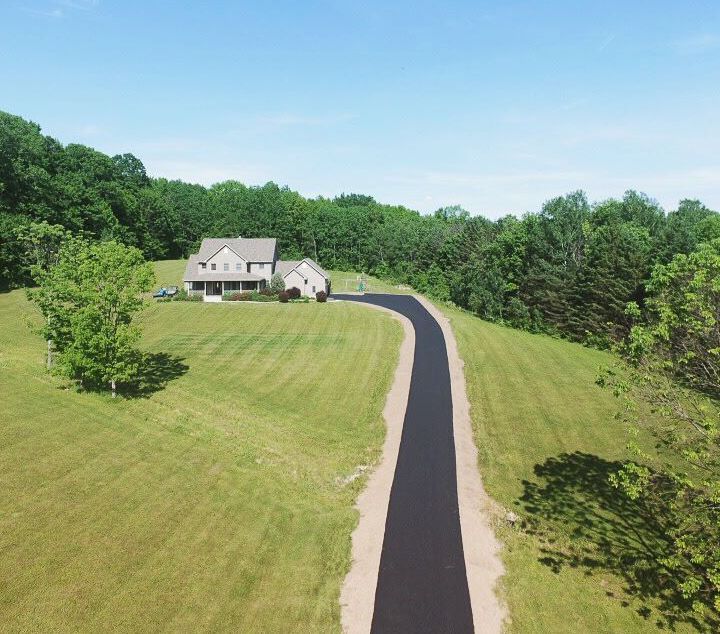 View of a road leading to a house