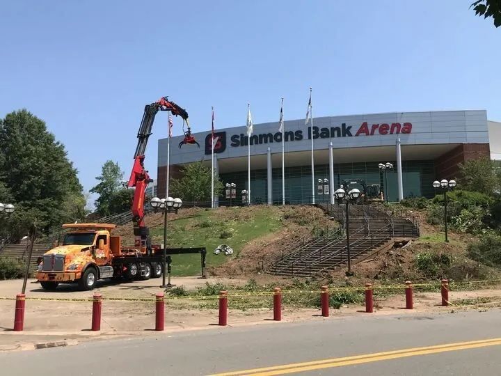 A truck is parked in front of the simmons bank arena