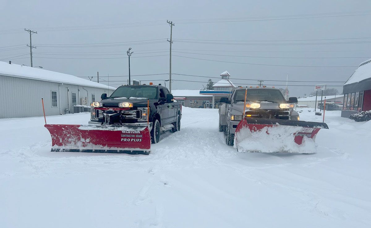 Two snow plowing trucks
