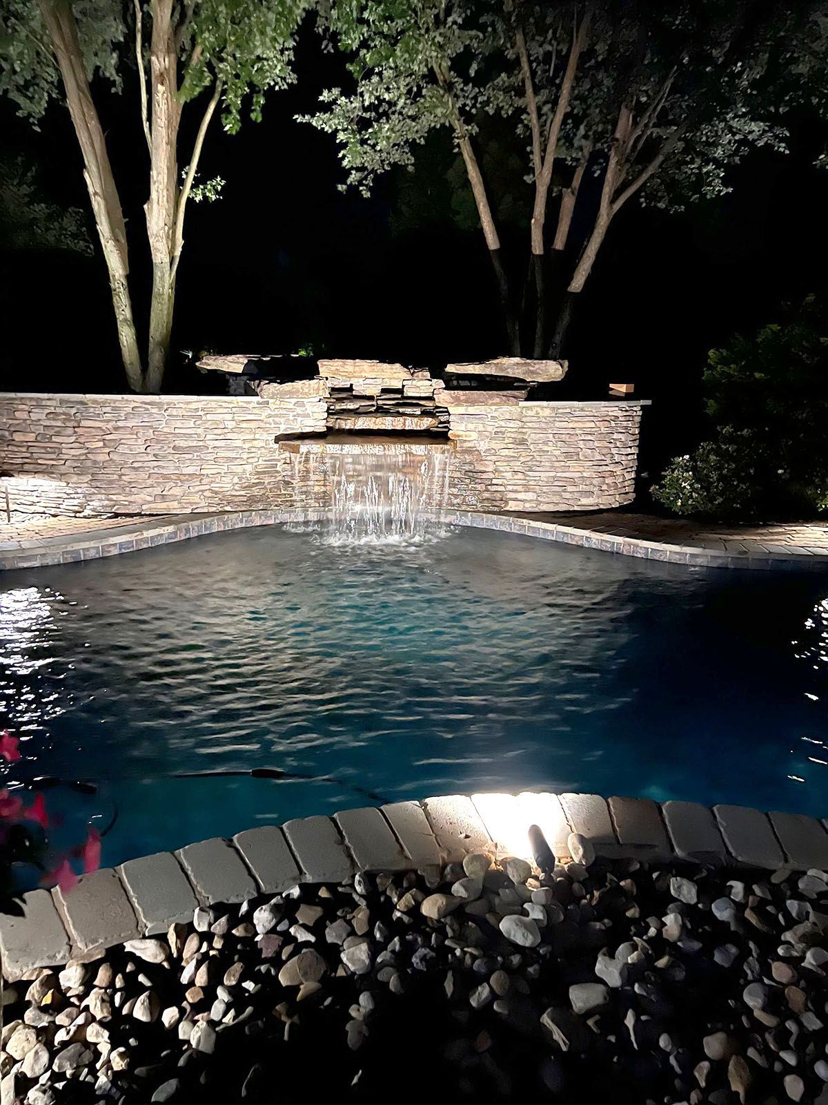A well-lighted swimming pool at night