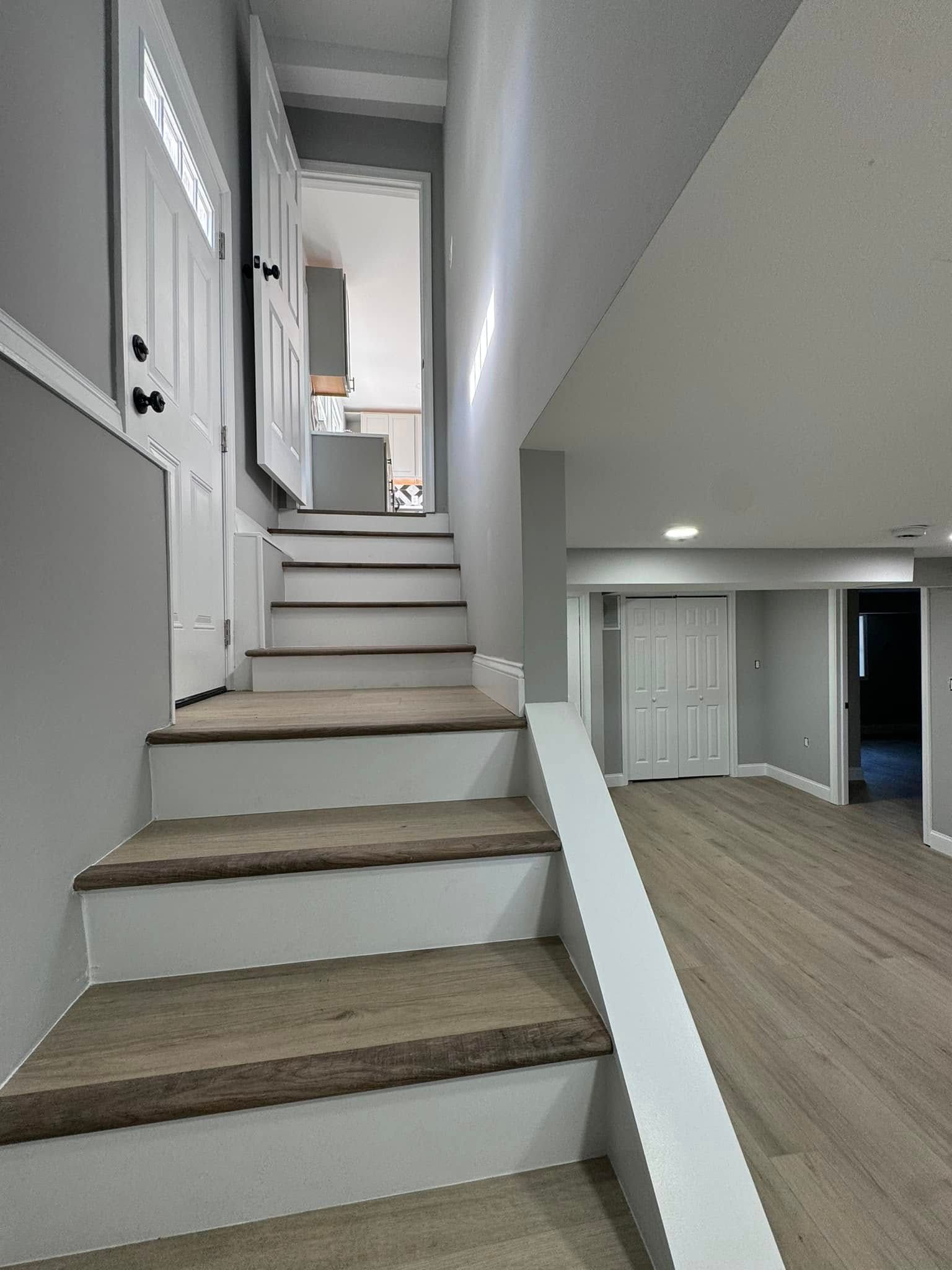 A set of stairs leading up to the second floor of a house.