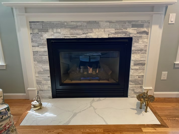 There is a fireplace in the middle of the room.