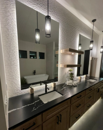 Modern bathroom vanity with black countertop, two mirrors, pendant lights, and wall shelves