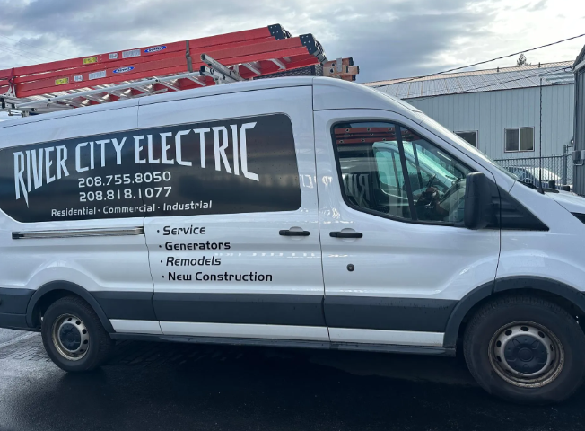White River City Electric service van with ladder rack parked outside a building