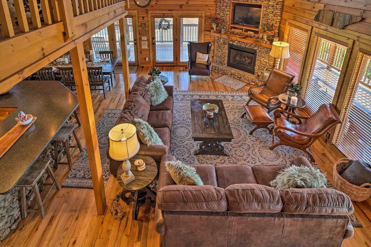 An aerial view of a living room filled with furniture and a fireplace.