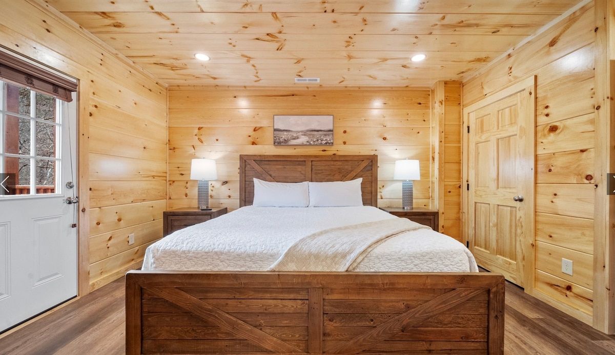 There is a king size bed in the middle of the room.