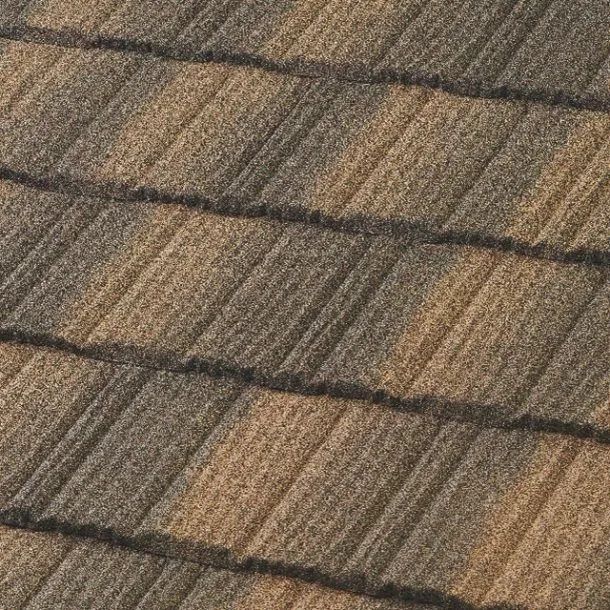 A close-up view of overlapping roof shingles in varied earth tones, featuring dark brown and tan textured surfaces.