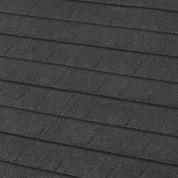 A close-up, angled view of dark grey, textured roofing shingles laid in horizontal rows.