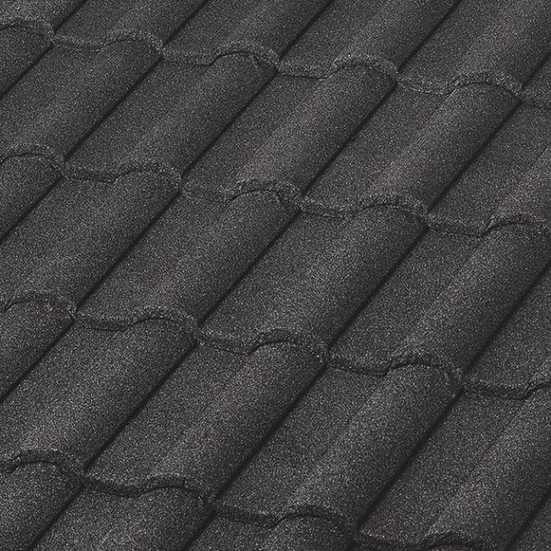 A close-up, angled view of dark grey, textured roof tiles arranged in a repeating, overlapping pattern.