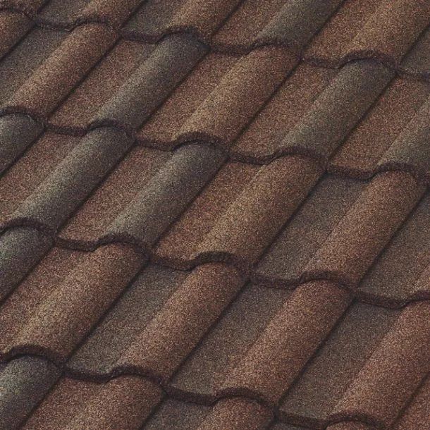 A close-up view of brown, weathered, textured roof tiles arranged in a repeating pattern.