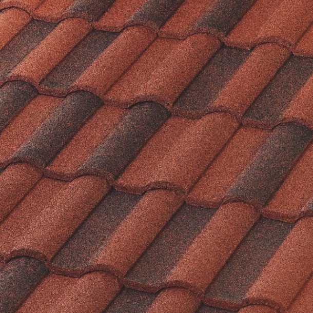 A pattern of overlapping terracotta-colored clay roof tiles with dark brown, weathered highlights.