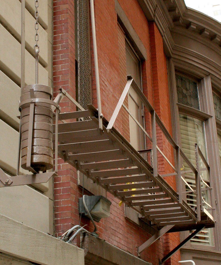 A fire escape is attached to the side of a building
