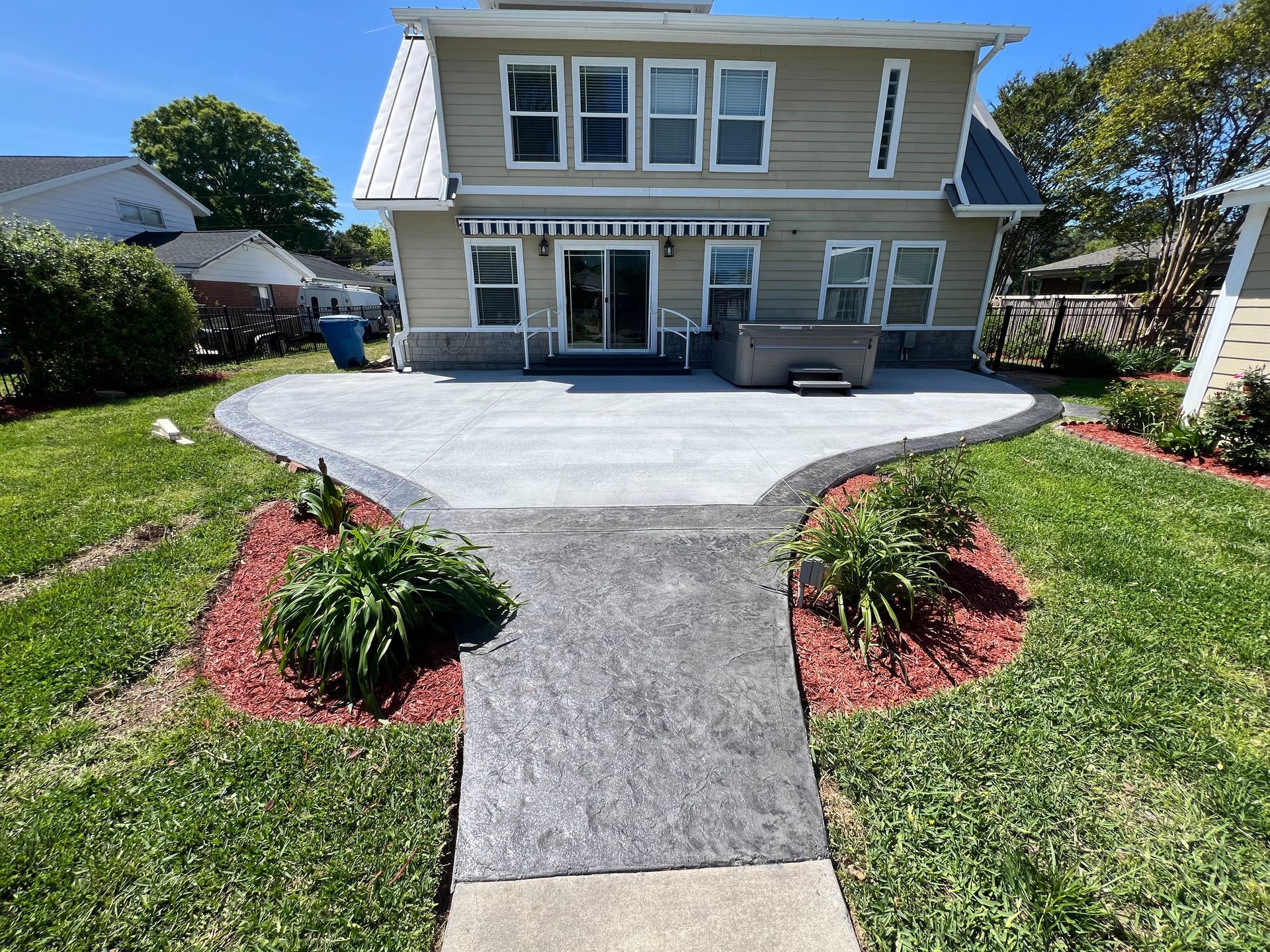 A house with a patio and a walkway leading to it
