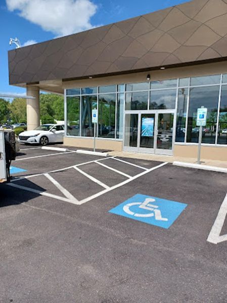 A handicapped parking spot in front of a building