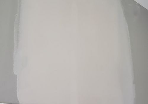 Blank white sheet of paper against a gray background