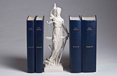 law books and a statue
