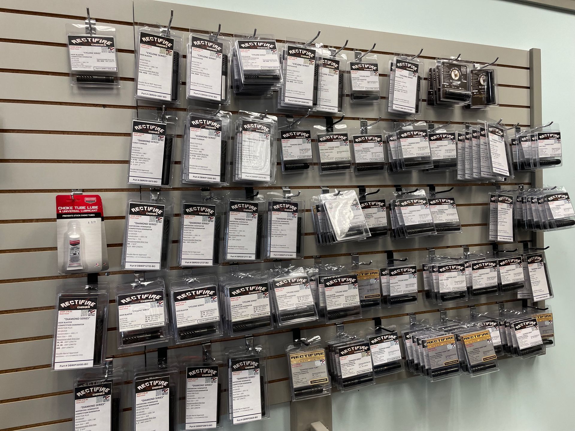 A wall filled with lots of different types of fishing gear.