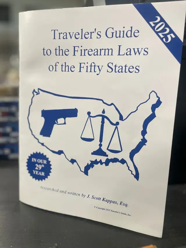 Booklet cover titled “Traveler’s Guide to the Firearm Laws of the Fifty States” with US map and gun icon, 2025 edition