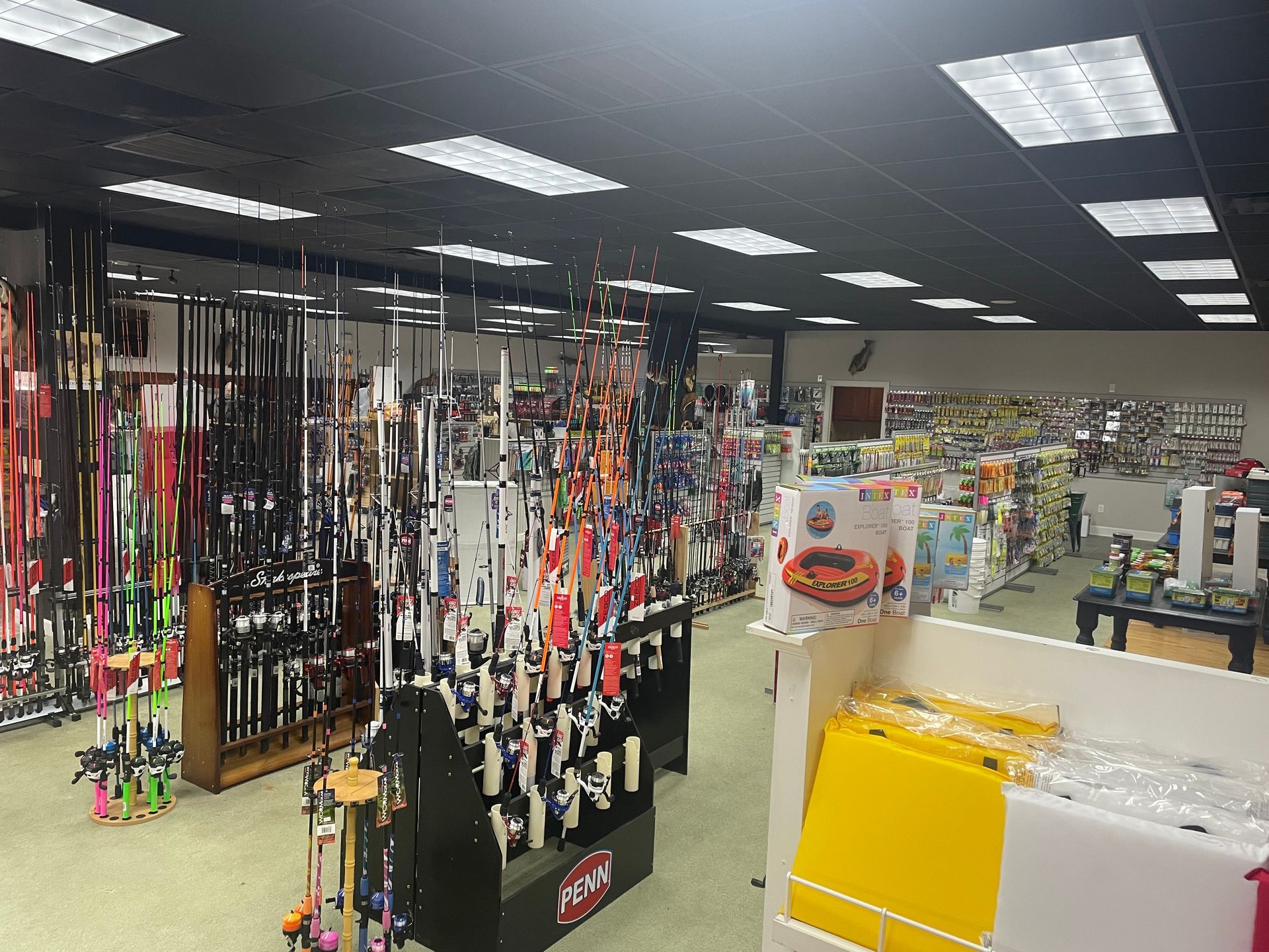 A large store filled with lots of items including fishing rods
