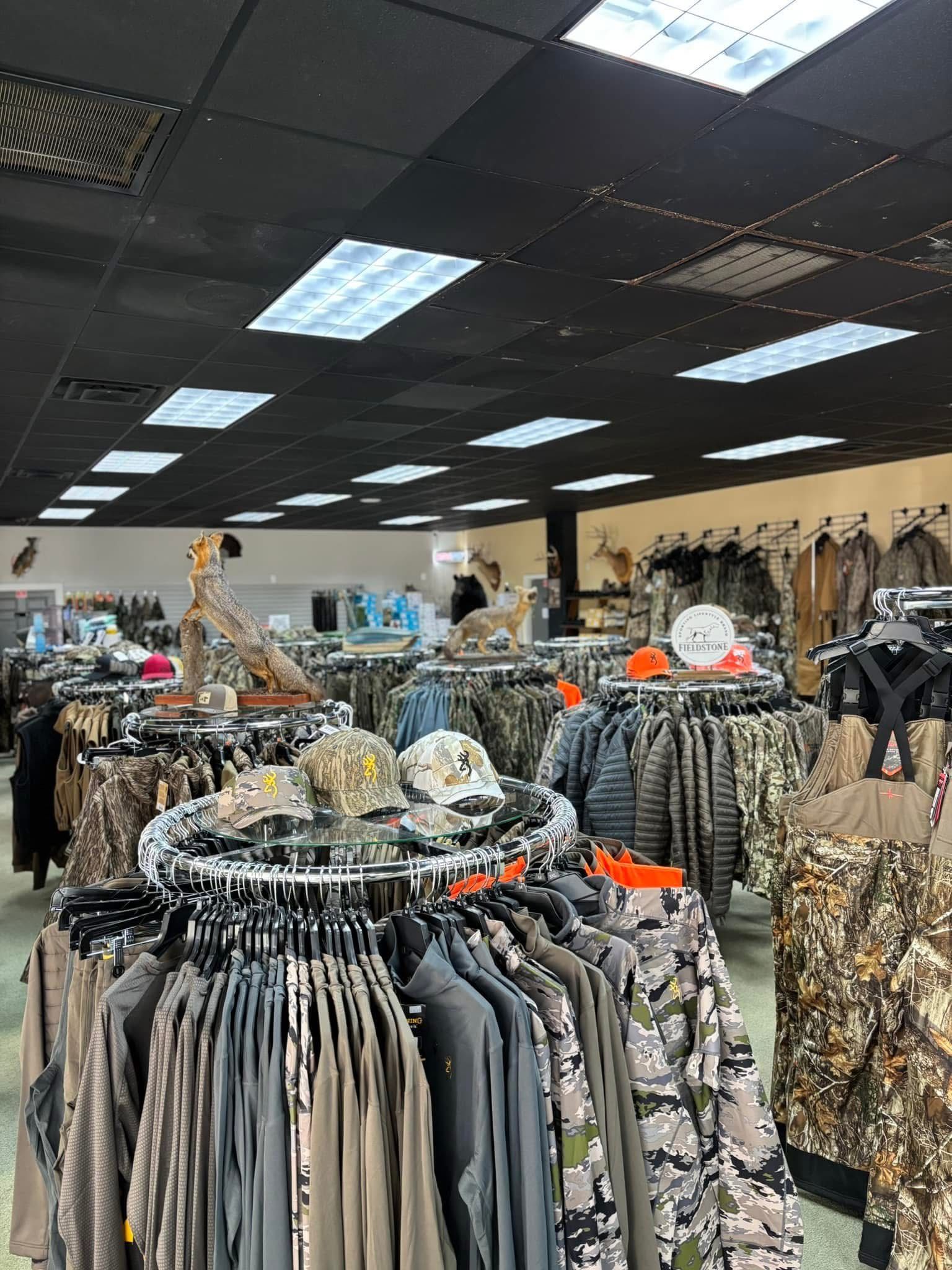 A large store filled with lots of clothes and hats.