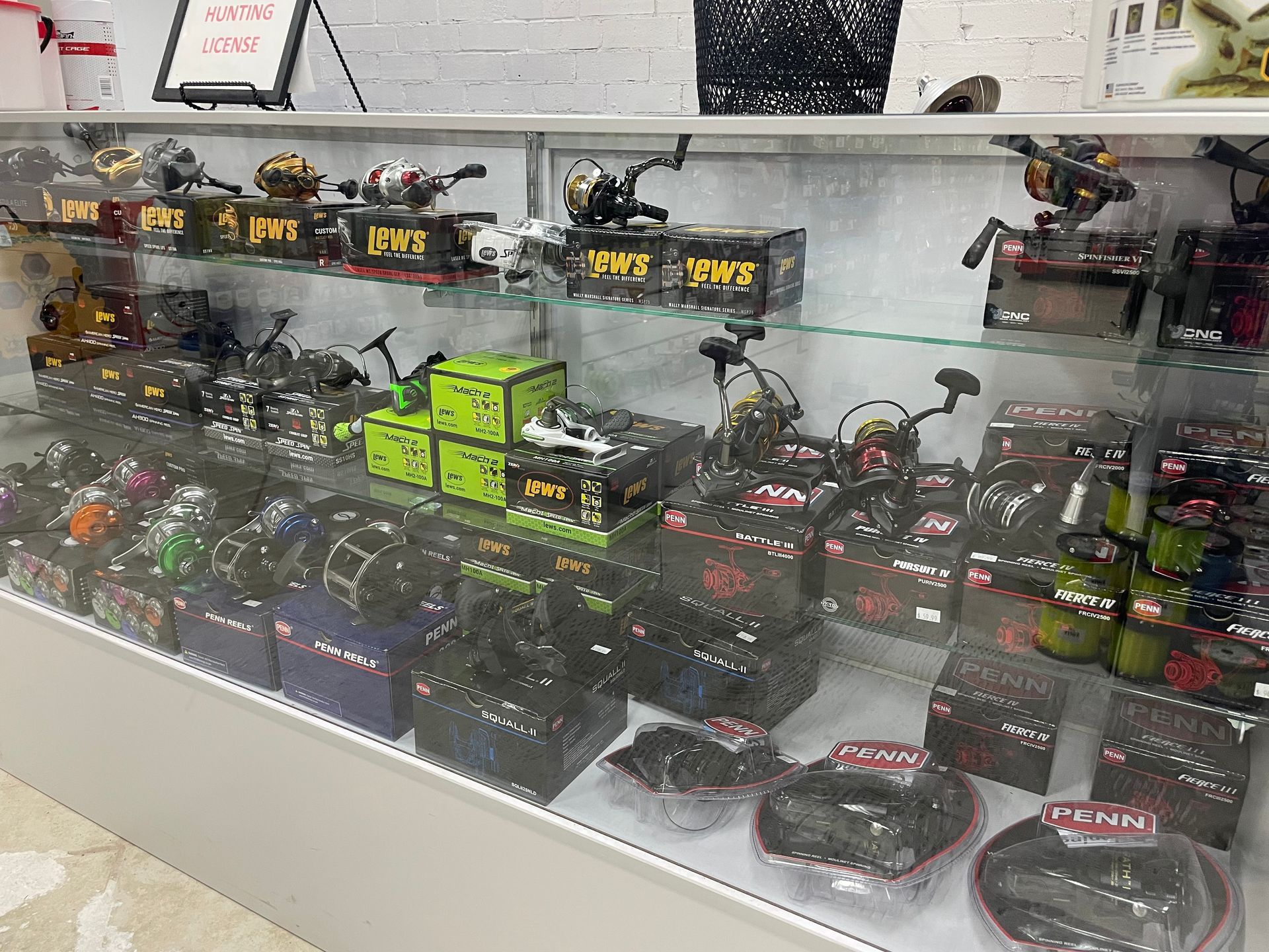 A display case filled with lots of fishing gear