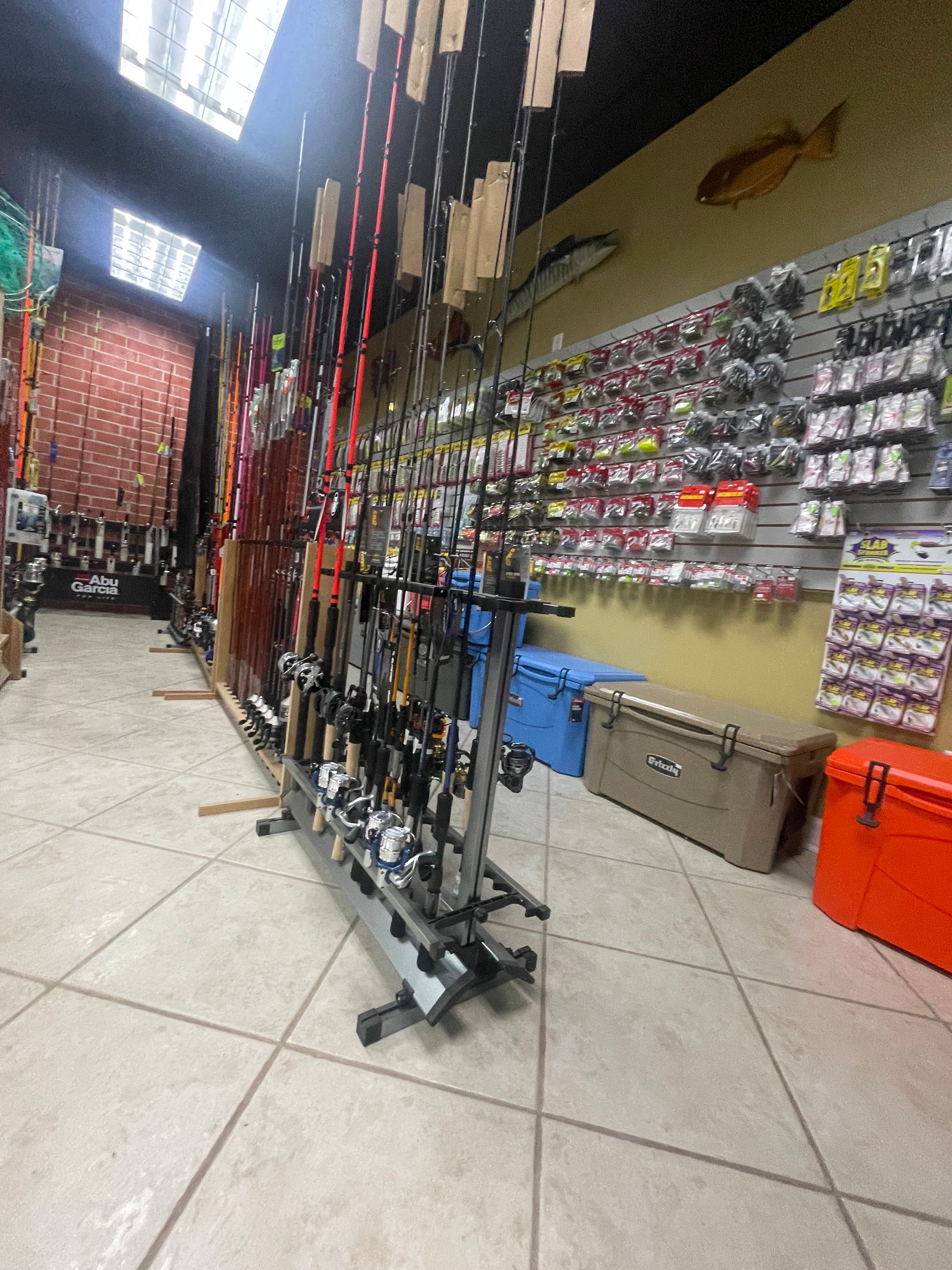 A fishing shop filled with lots of fishing rods and lures.