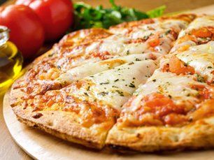 close-up of a cheese pizza with tomato sauce
