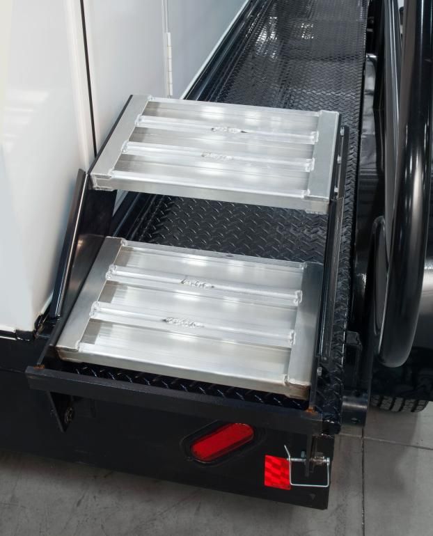 A set of stairs on the side of a vehicle