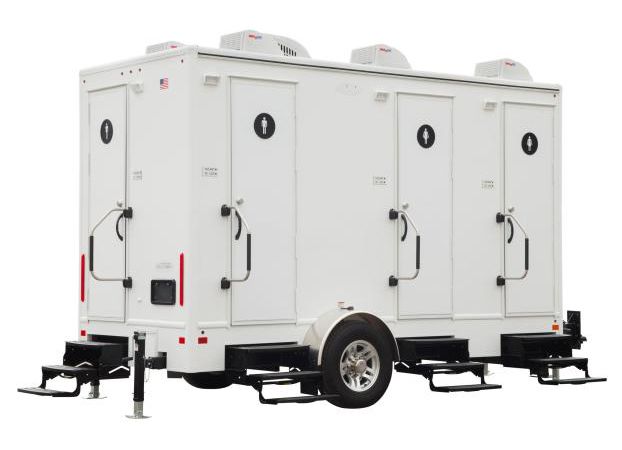 A white trailer with four toilets on it on a white background