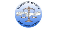 Worcester County Bar Association logo: Scales of justice in a blue circle with