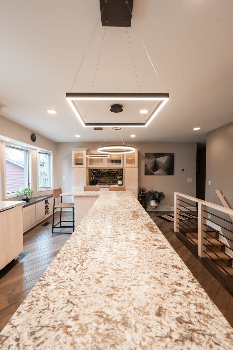 There is a long table in the middle of the room.