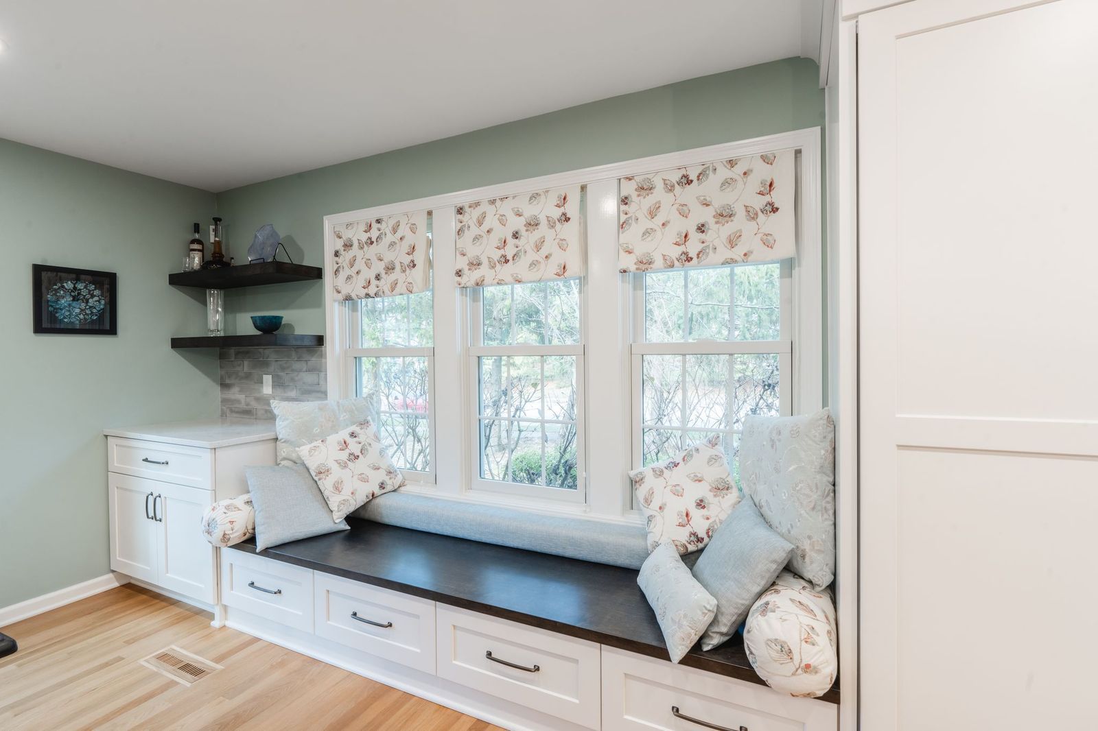 There is a window seat in the middle of the room.