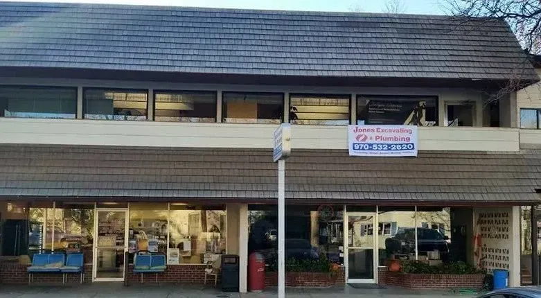 A large building with a sign on the side of it that says