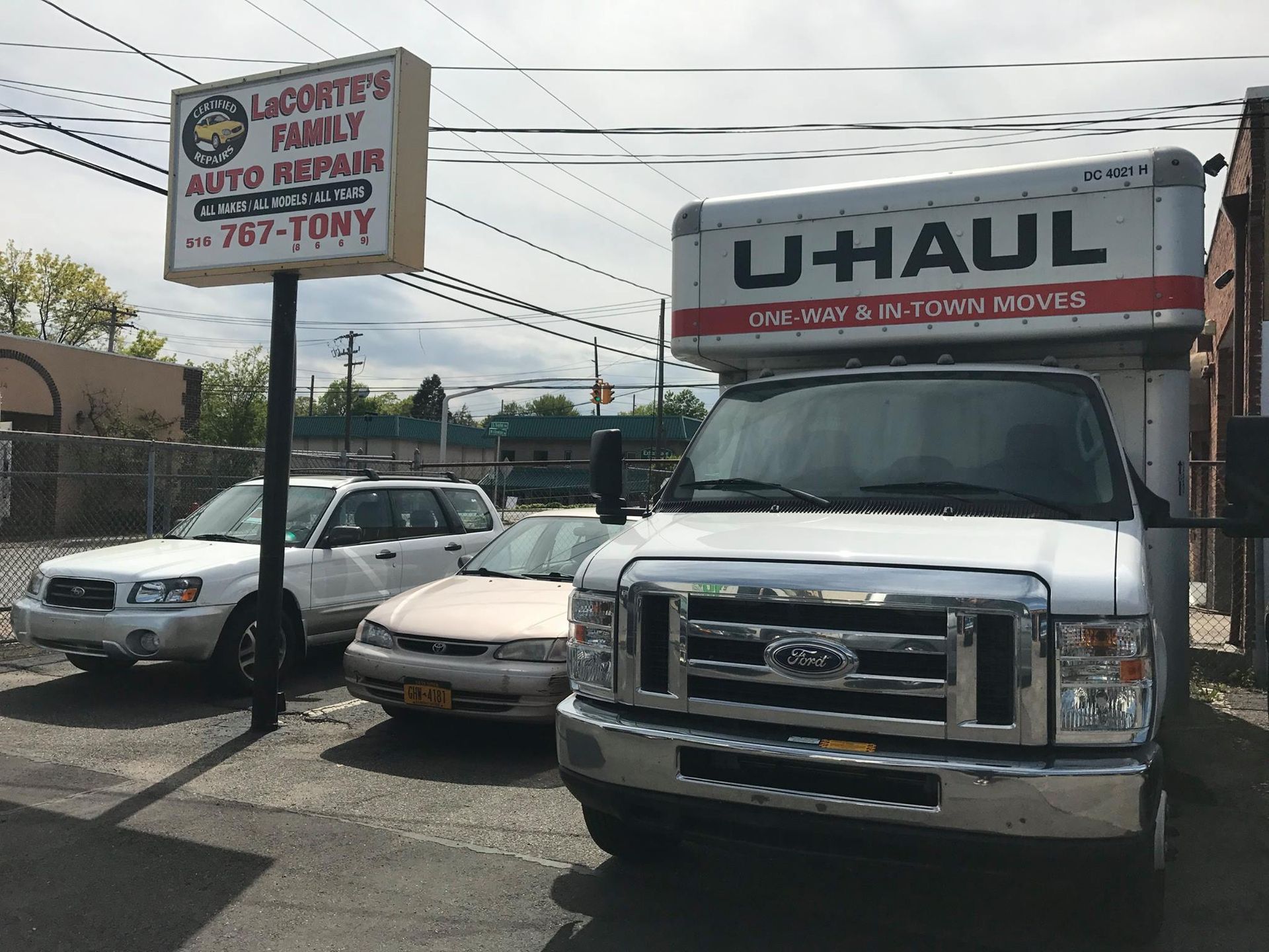 U-Haul truck parked near a sign for 