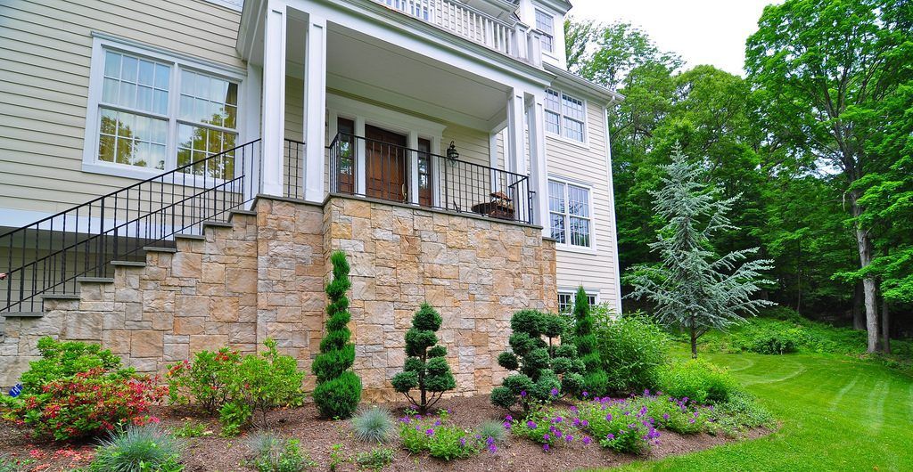 Multi-Level Sloped Rock and Grass Garden