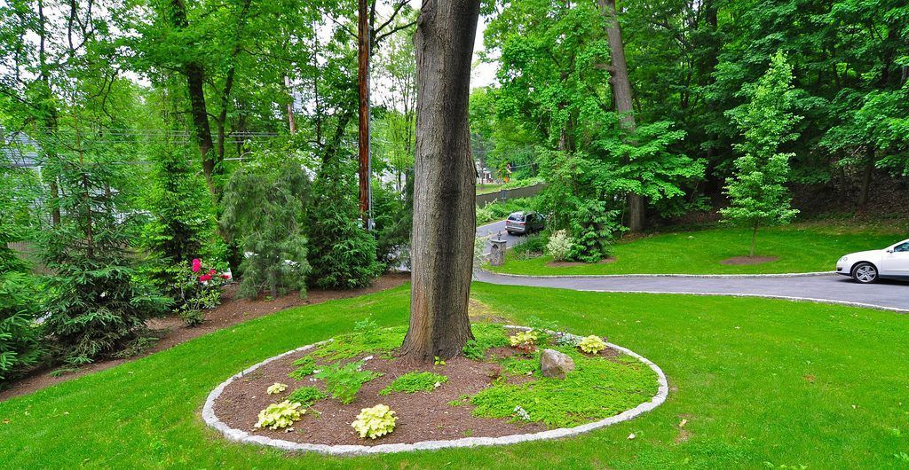 Multi-Level Sloped Rock and Grass Garden