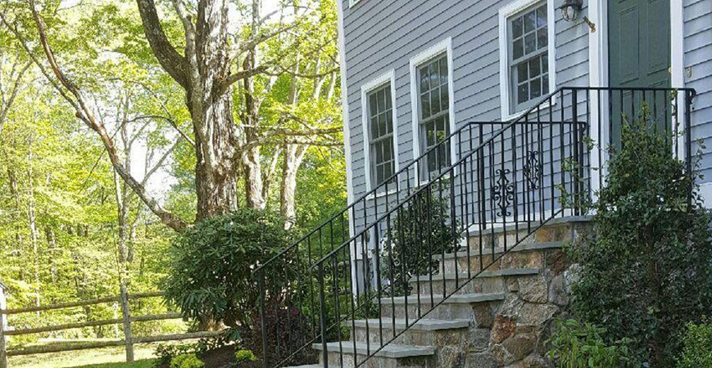 Stone Staircase Entrance with Wrought Iron Railing