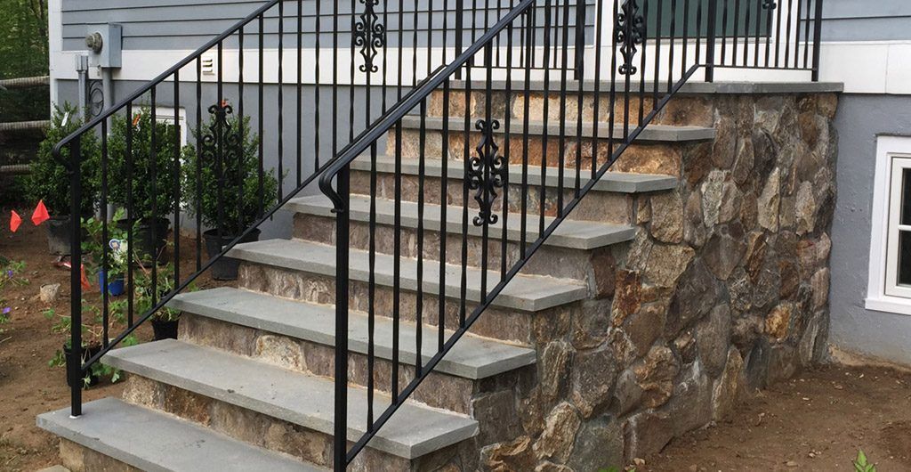 Stone Staircase Entrance with Wrought Iron Railing