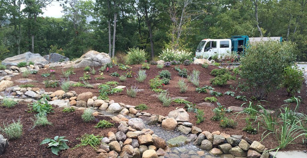 Water Feature with River Rock Pathways Landscape Design