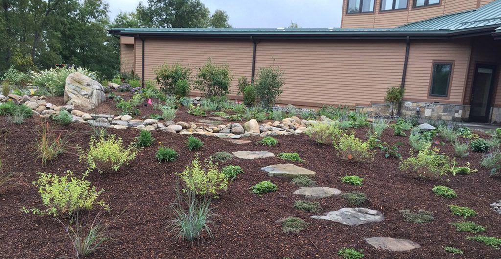 Water Feature with River Rock Pathways Landscape Design