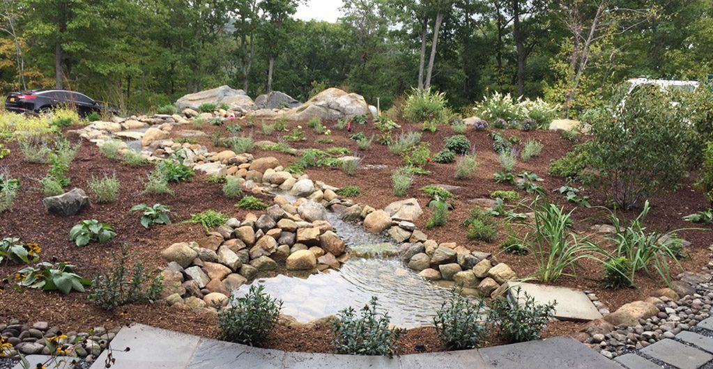 Water Feature with River Rock Pathways Landscape Design