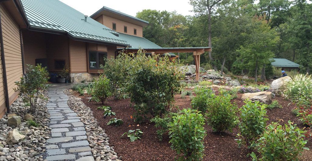 Water Feature with River Rock Pathways Landscape Design