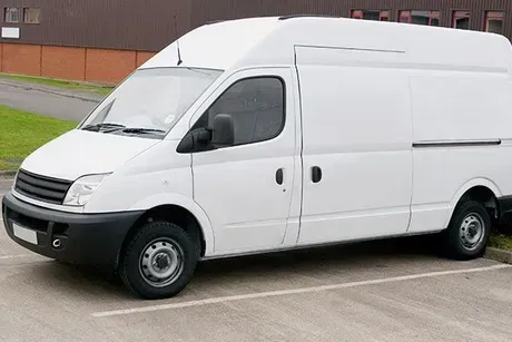 White delivery van parked outdoors.
