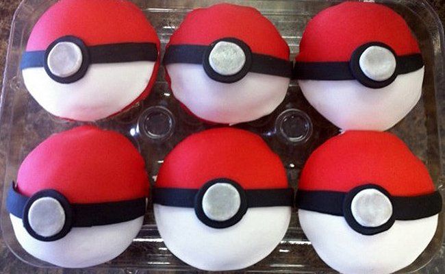 A plastic container filled with red and white pokeballs