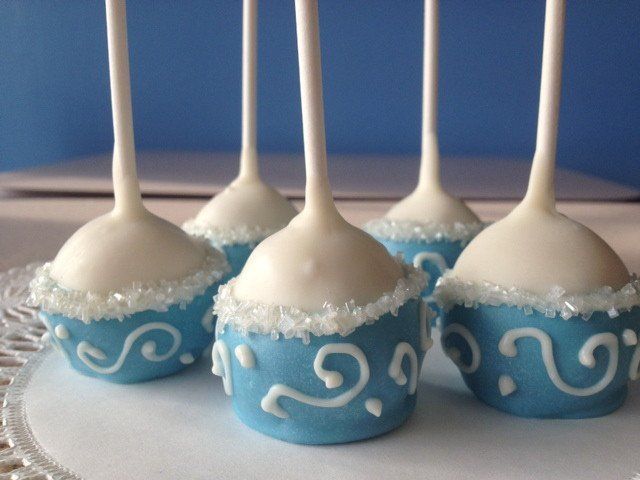 Blue and white cake pops with swirls on them